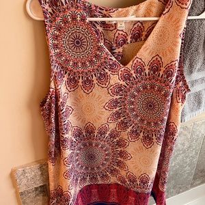 Blouse bought for golfing with husband but too big on me. Size med. never worn .